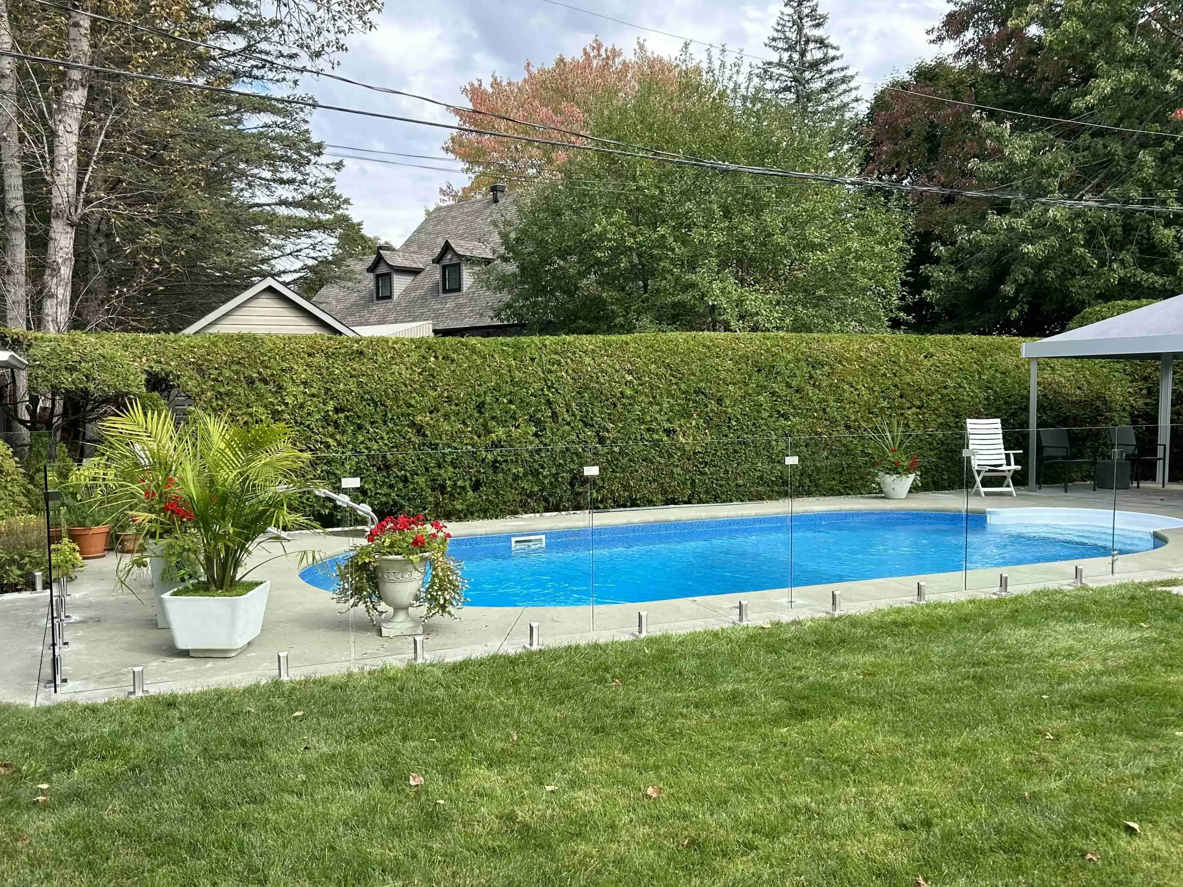 Modern glass railing installation with stainless steel spigots